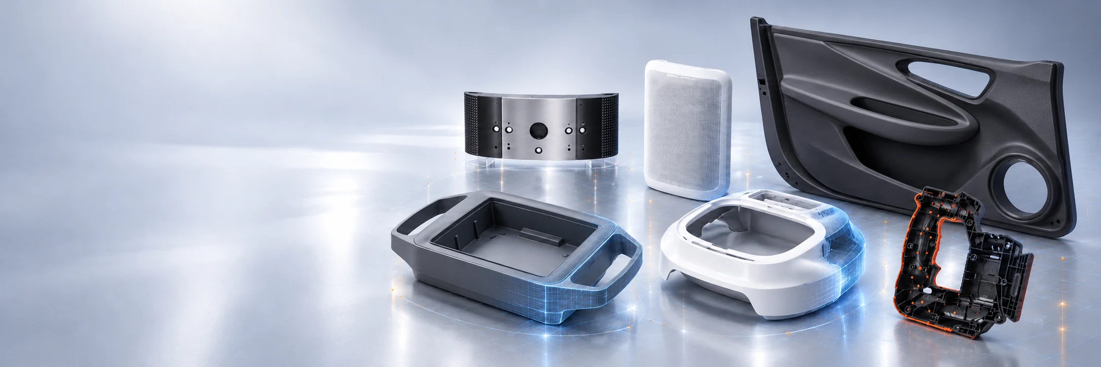 Illustrative molded application components on an engineering workbench.