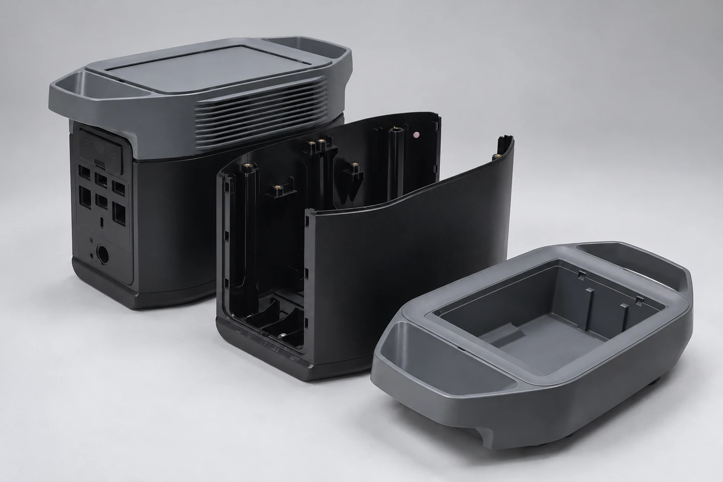 Molded enclosure parts showing ribs, bosses and threaded inserts.