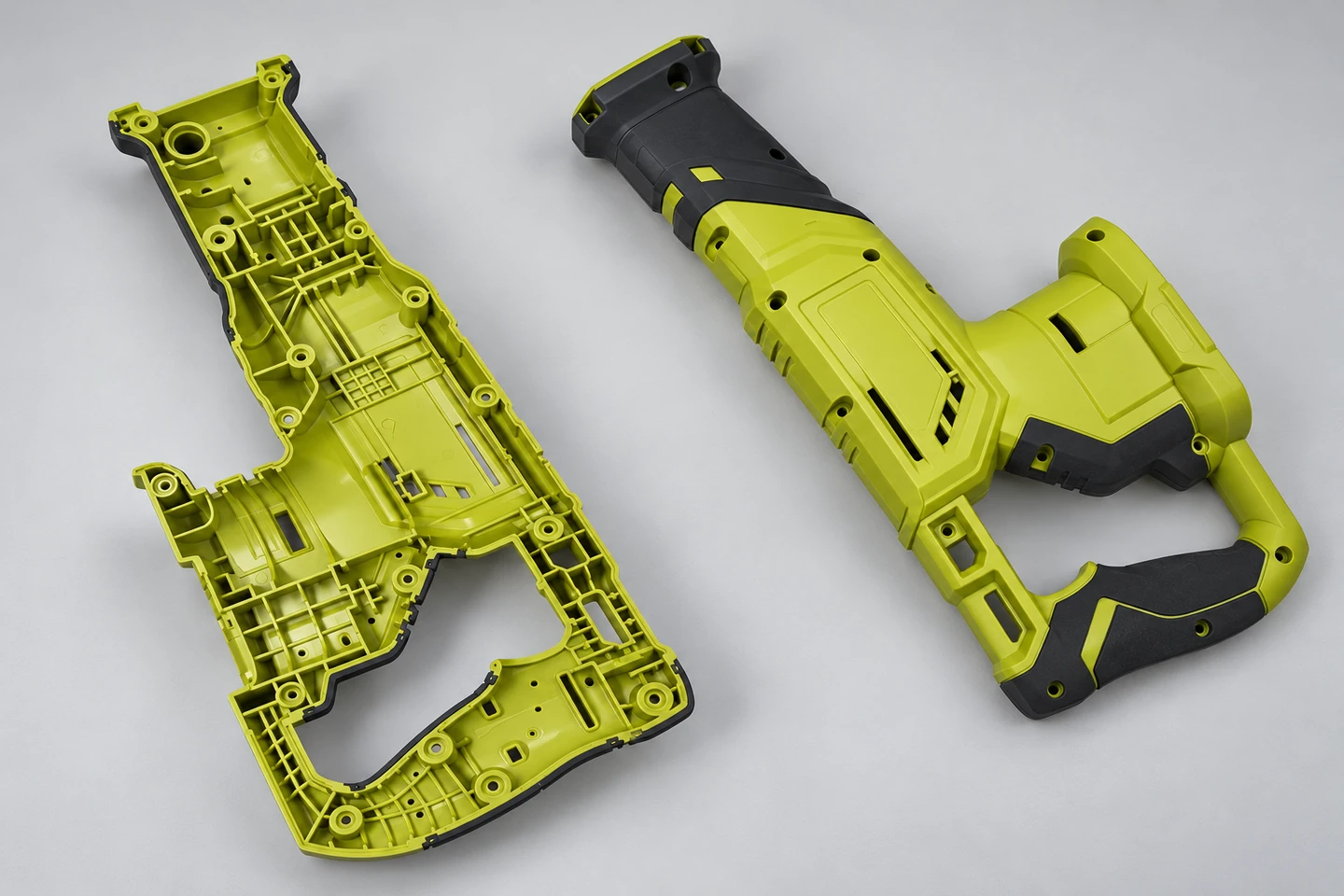 Molded tool-housing halves showing ribs, bosses and fastening interfaces.